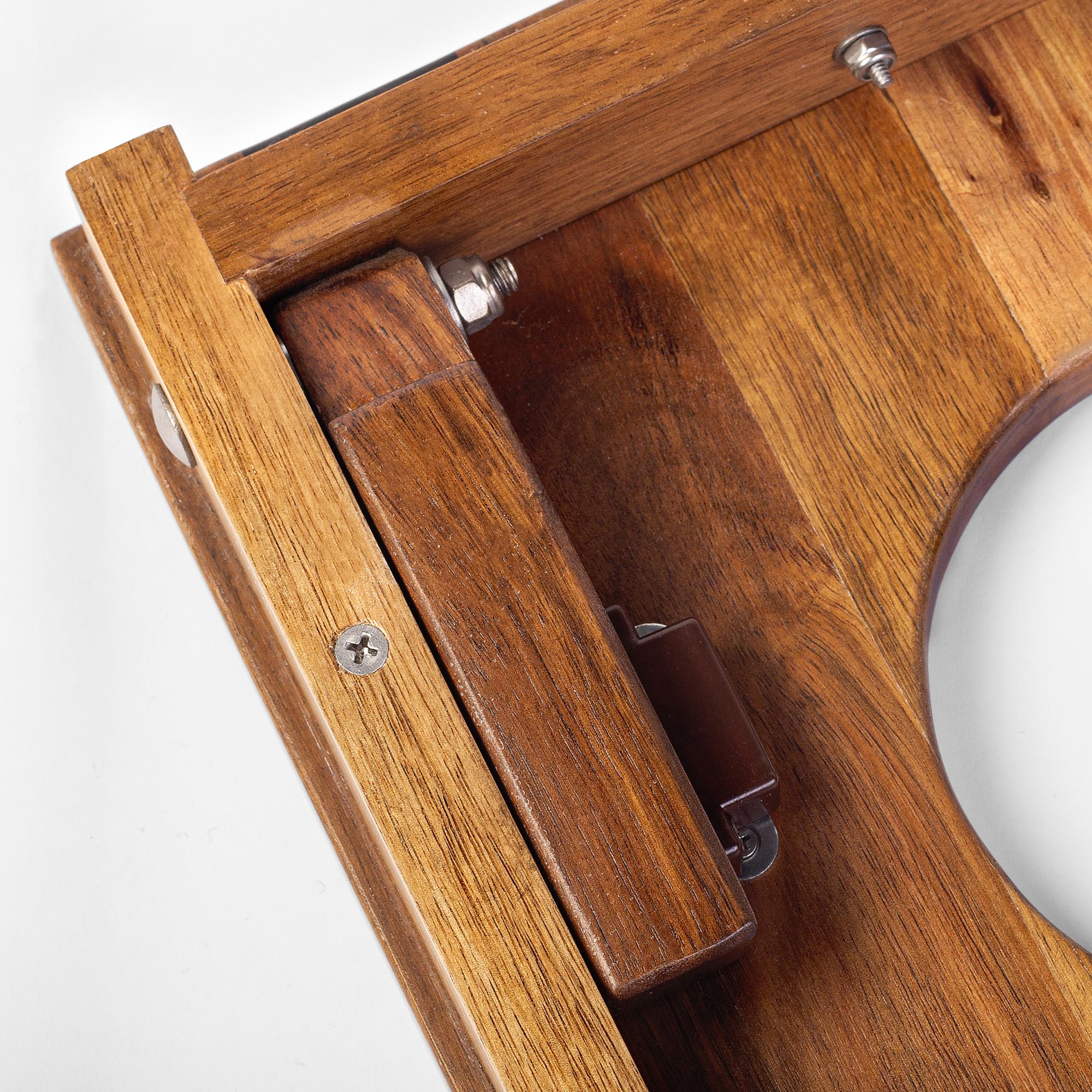 Close-up of 1x2 travel cornhol boards' legs collapsed within its frame