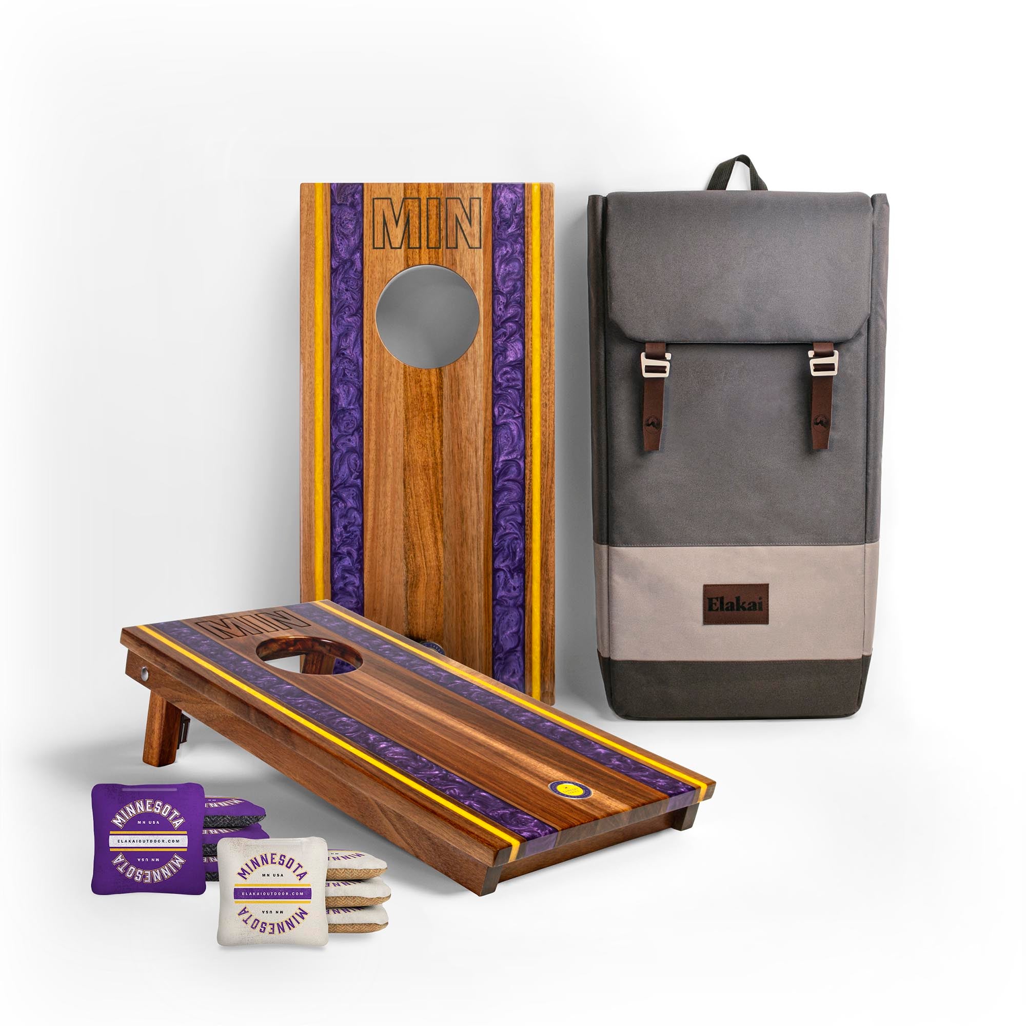 1x2 Gameday Resin Travel Cornhole Board Set with resin purple and yellow stripes, a gray backpack and two sets of Minnesota cornhole bags
#color_minnesota