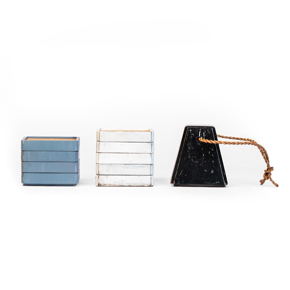 Stackable buoy coaster set separated to show tabletop coasters and decorative storage