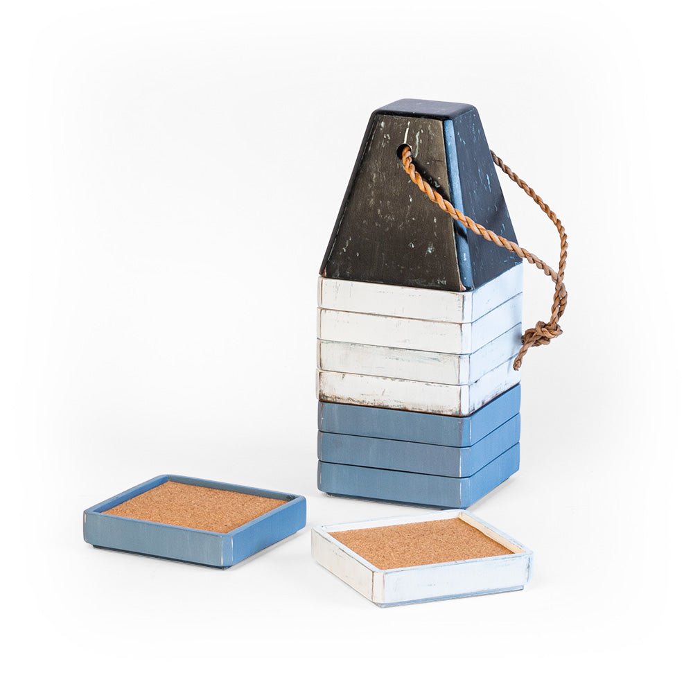 Decorative buoy coaster set shown stacked with blue and white cork drink coasters