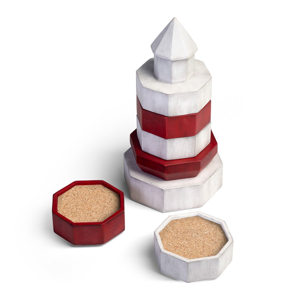 Decorative lighthouse coaster set shown stacked with red and white drink coasters