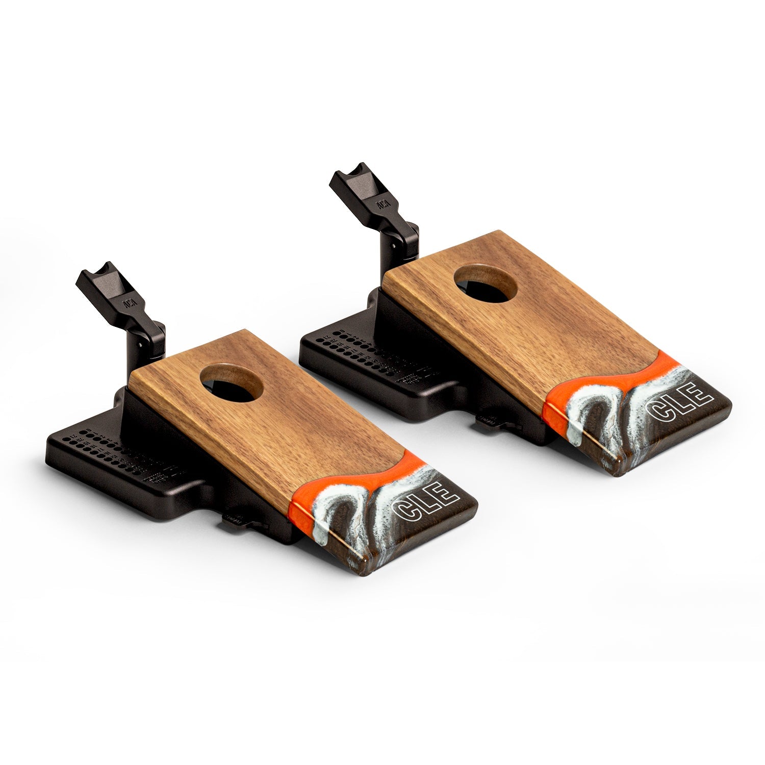 Angled view of the Elakai Cleveland Gameday mini double chuck tabletop cornhole set featuring wood boards with orange, brown, and white resin design and built-in launch flippers #color_cleveland