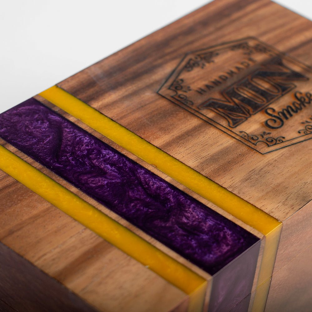 Elakai cedar-lined acacia hardwood cigar box with handcrafted resin accent and hinged lid for decorative cigar storage.
#color_minnesota