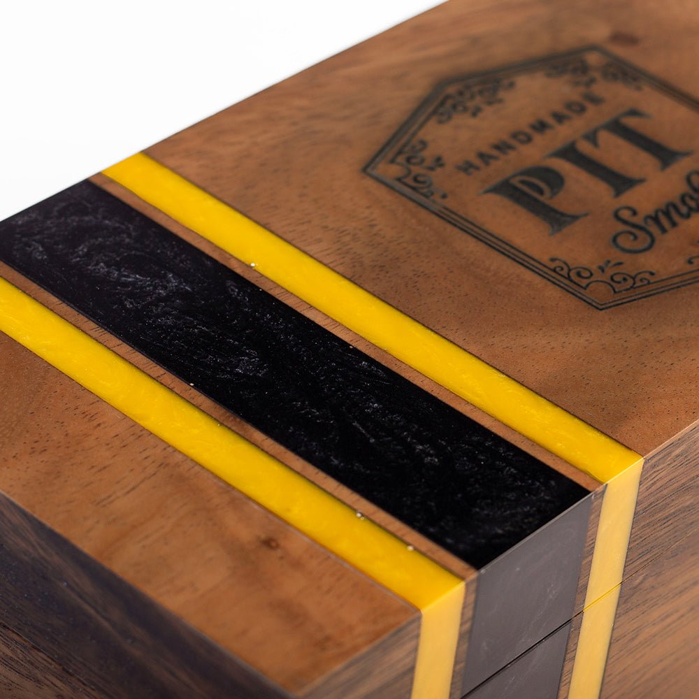 Elakai cedar-lined acacia hardwood cigar box with handcrafted resin accent and hinged lid for decorative cigar storage.
#color_pittsburgh