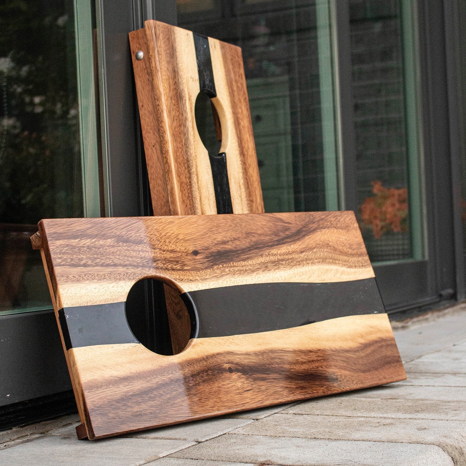 Close-up of solid acacia wood grain on an Elakai game board, highlighting natural variation, warm tones, and handcrafted detail.