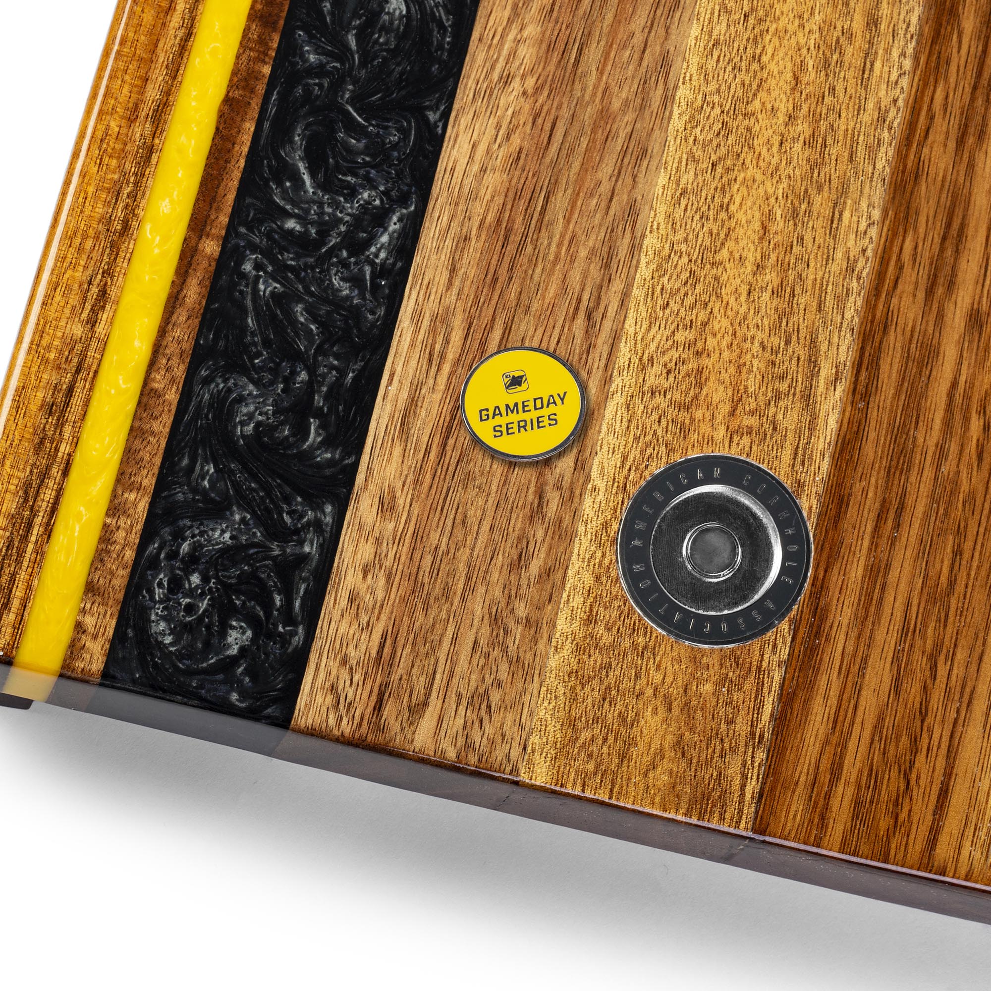 close-up detail of resin inlay and gameday coin insert on travel cornhole board
#color_pittsburgh