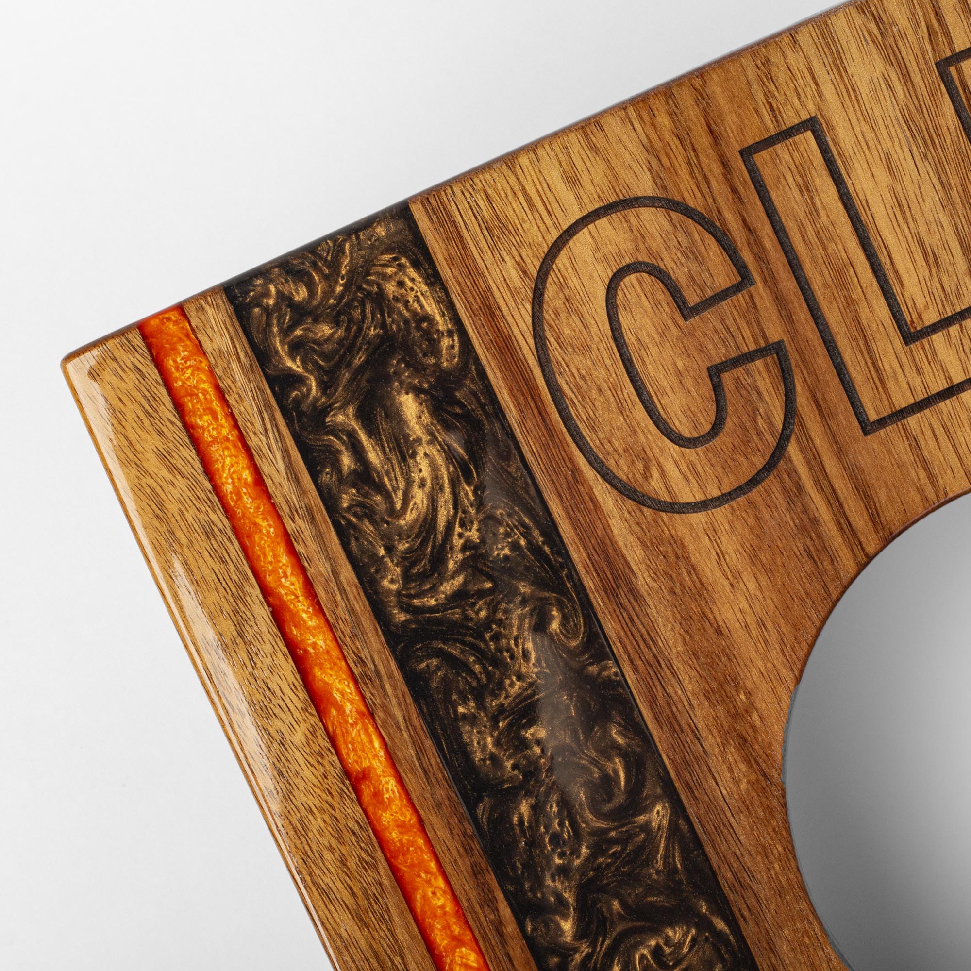 resin and 'CLE' engraving detail on a wooden 1x2 travel cornhole board
#color_cleveland