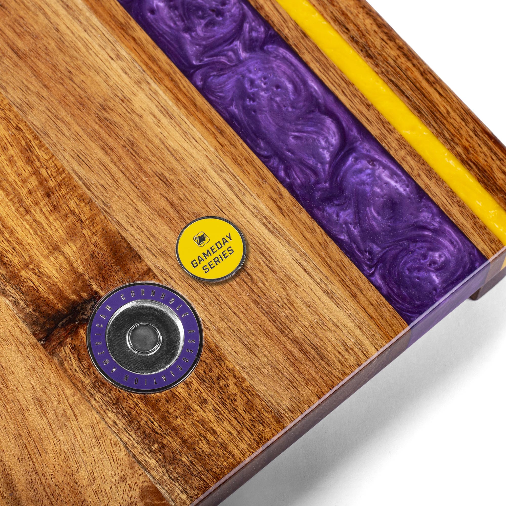 close-up detail of resin inlay and gameday coin insert on travel cornhole board
#color_minnesota