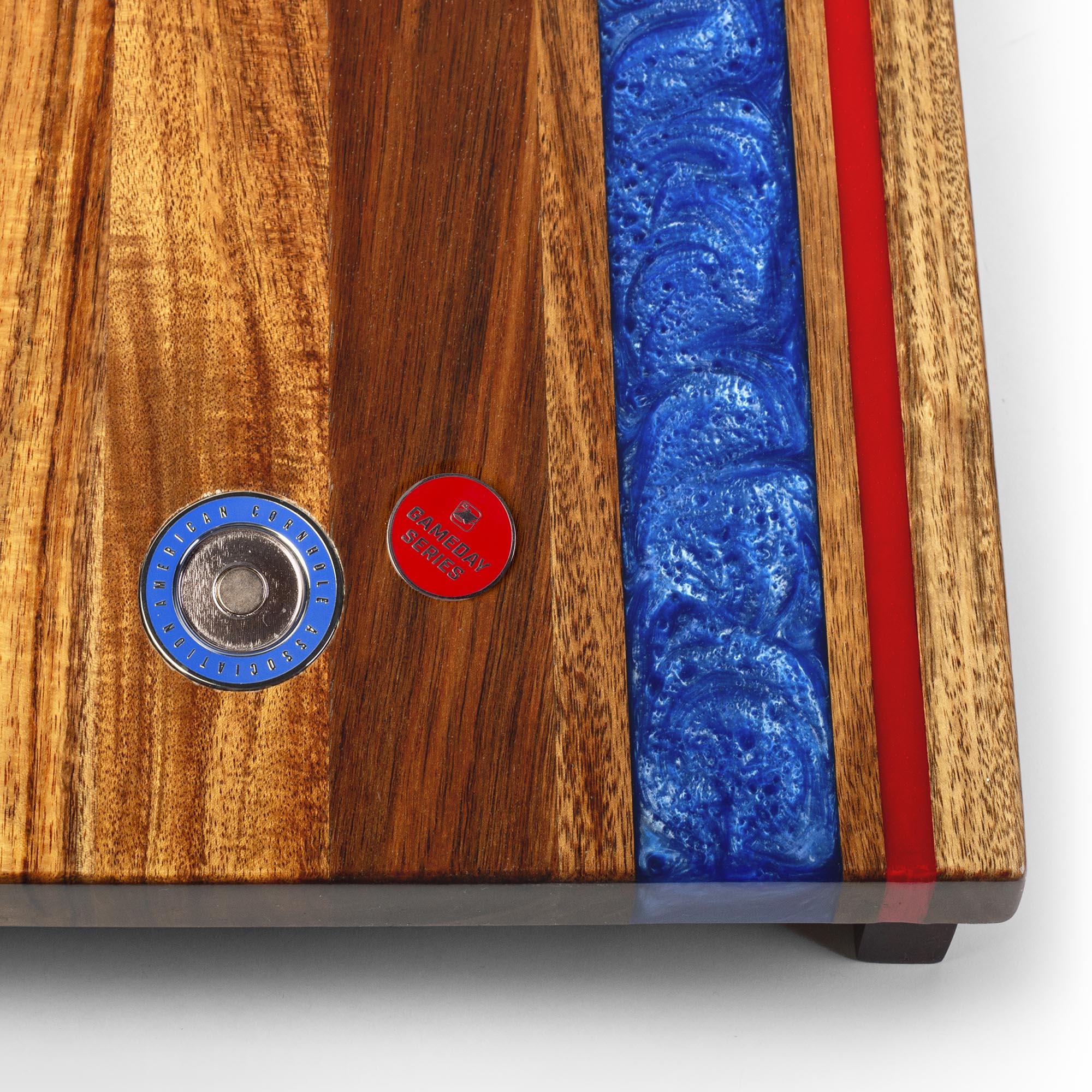 close-up detail of resin inlay and gameday coin insert on travel cornhole board
#color_buffalo