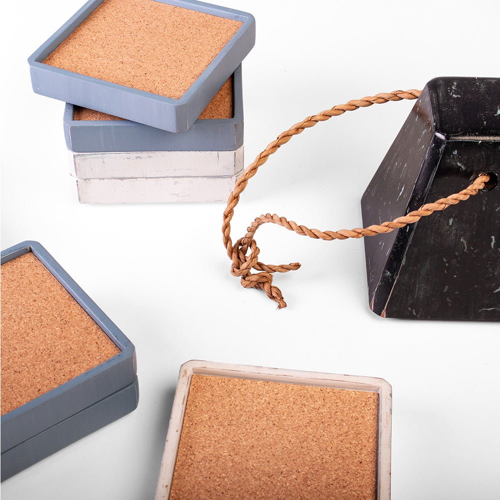 Blue and white wooden coasters with cork surfaces from a decorative buoy stacking coaster set
