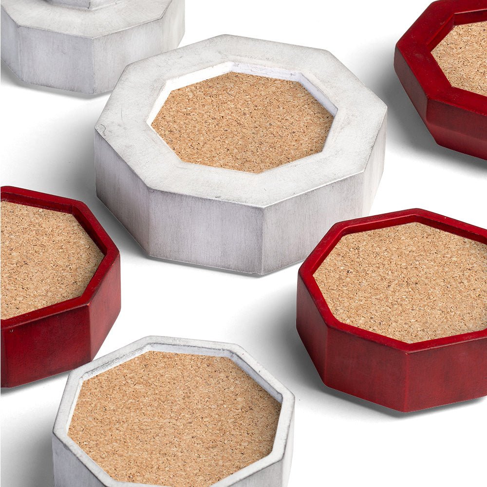 Red and white wooden coasters with cork surfaces from a decorative coastal lighthouse coaster set