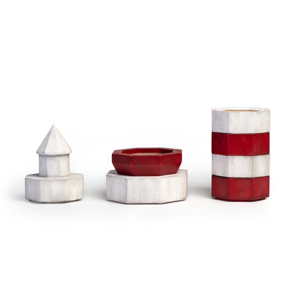 Stackable lighthouse coaster set separated to show individual tabletop coasters and decorative storage