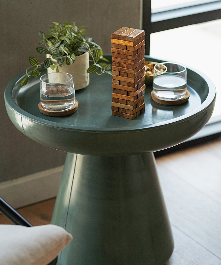 Mini Mountain Blocks wooden stacking game styled on a modern side table with decorative accents. 