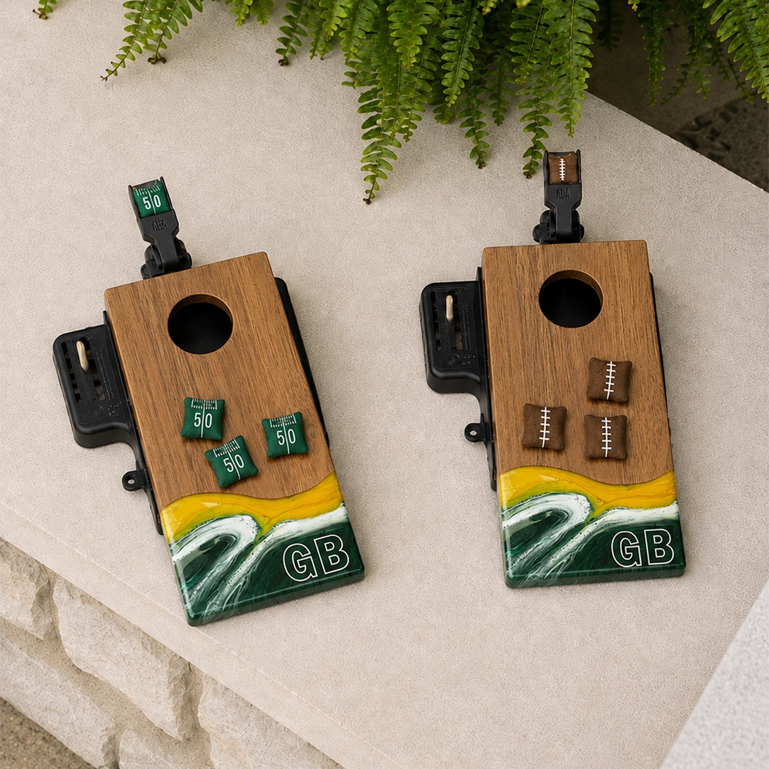 Two wooden cornhole boards featuring a yellow, white, and green wave design at the bottom with 'GB' lettering.

#color_green bay
