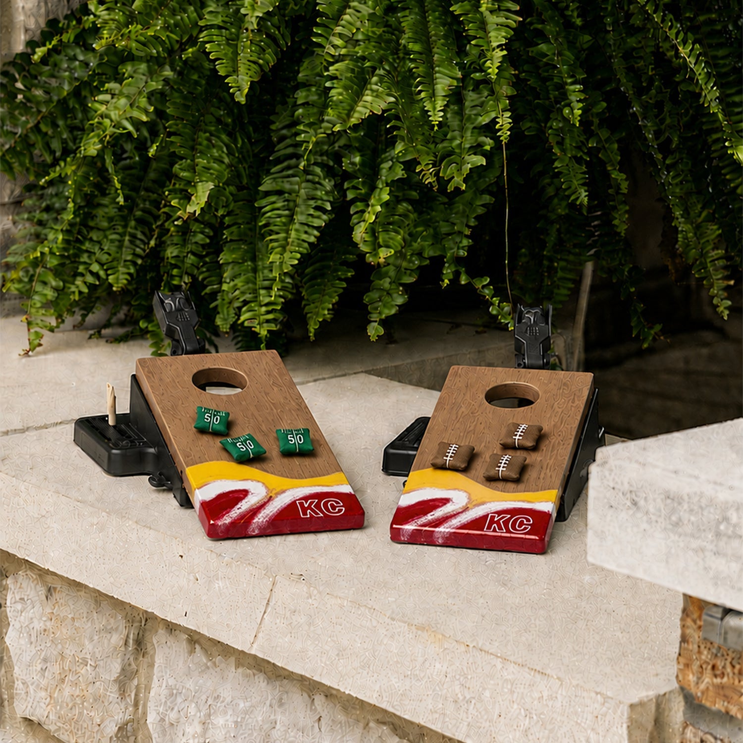 Two wooden cornhole boards featuring a yellow, white, and red wave design at the bottom with 'KC' lettering.

#color_kansas city