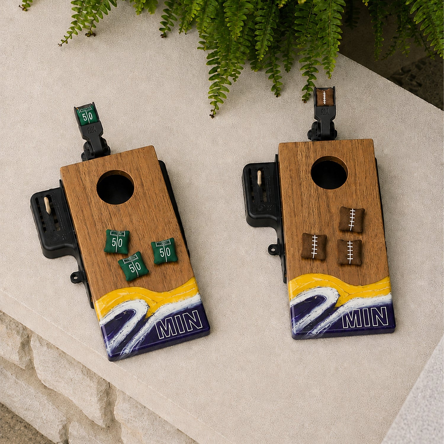 Two wooden cornhole boards featuring a yellow, white, and purple wave design at the bottom with MIN' lettering.

#color_minnesota