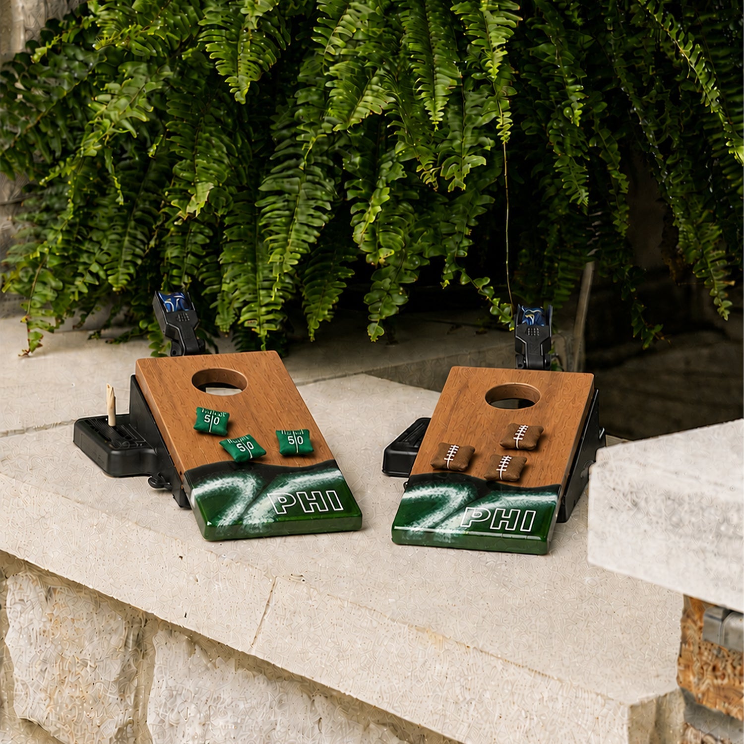 Two wooden cornhole boards featuring a green, white, and black wave design at the bottom with 'PHI' lettering.

#color_philadelphia