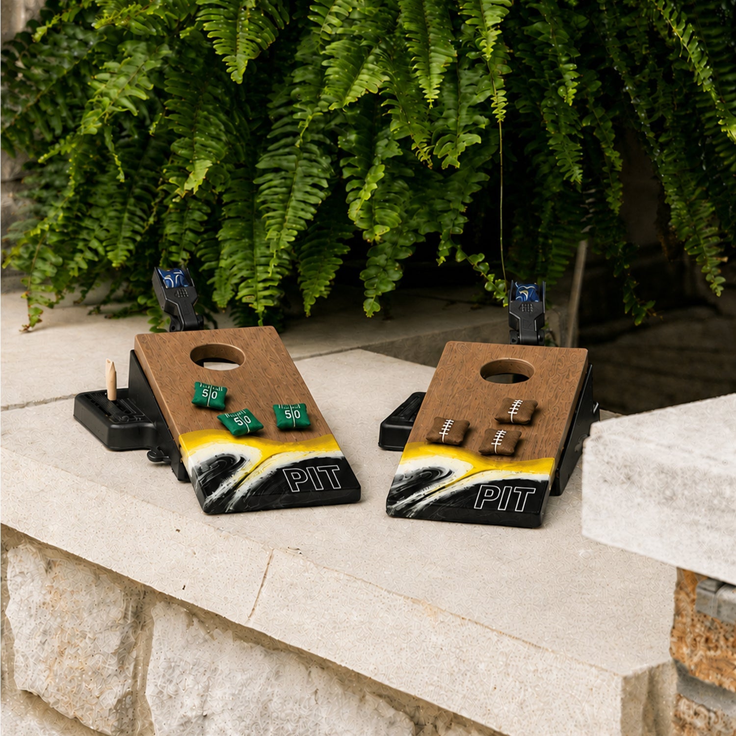 Two wooden cornhole boards featuring a yellow, white, and black wave design at the bottom with 'PIT' lettering.

#color_pittsburgh
