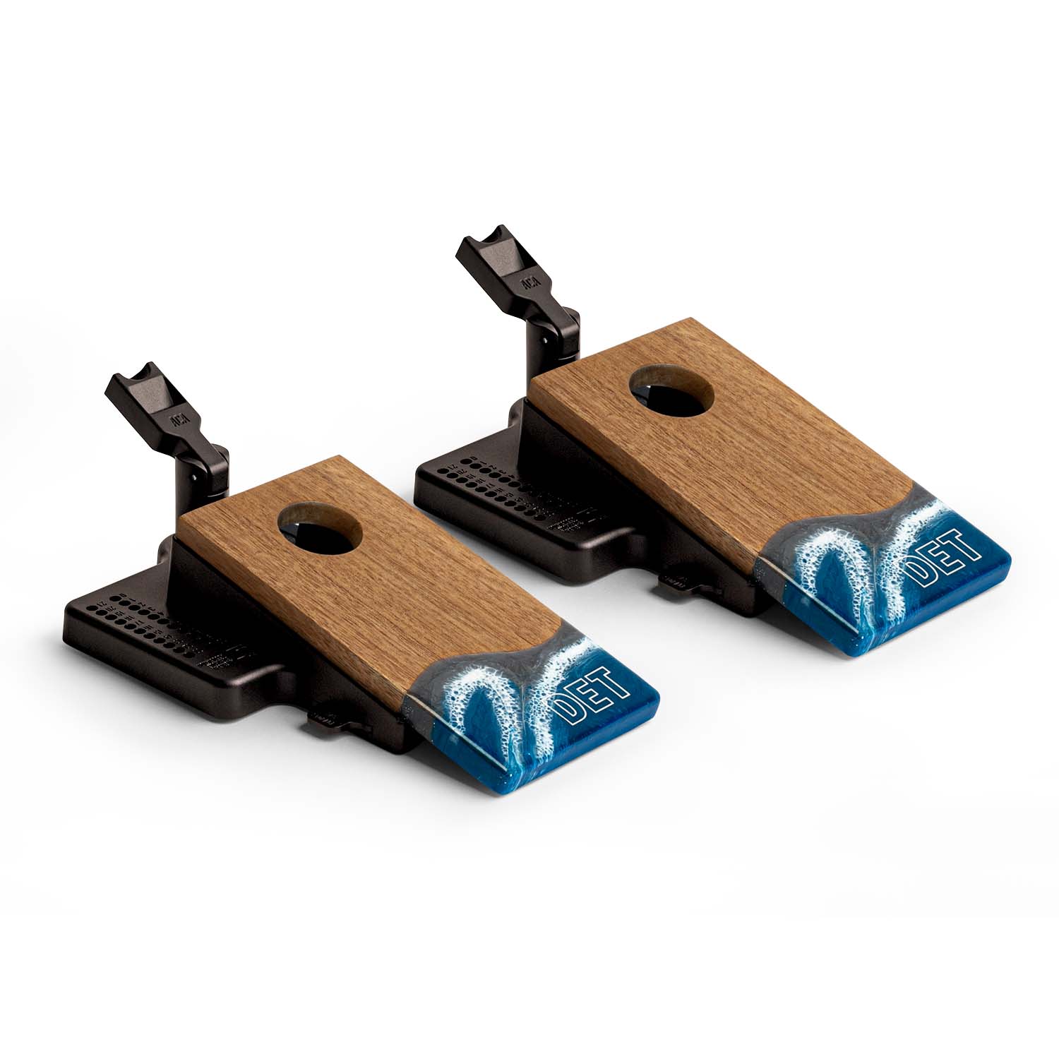 Angled view of the Elakai Detroit Gameday mini double chuck tabletop cornhole set featuring wood boards with blue, gray, and white resin design and built-in launch flippers #color_detroit