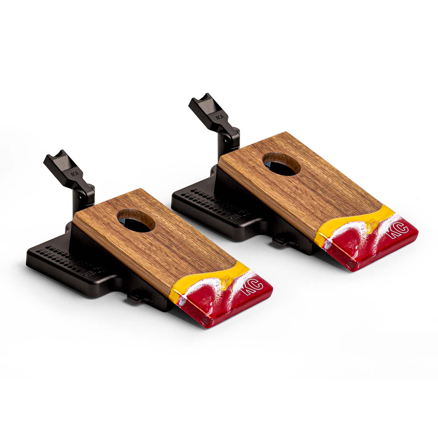 Angled view of the Elakai Kansas City Gameday mini double chuck tabletop cornhole set featuring wood boards with red, gold, and white resin design and built-in launch flippers #color_kansas city