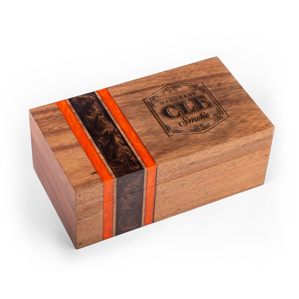 Elakai premium cedar-lined cigar box handcrafted from acacia hardwood with orange and black resin inlay for luxury cigar storage.

#color_cleveland