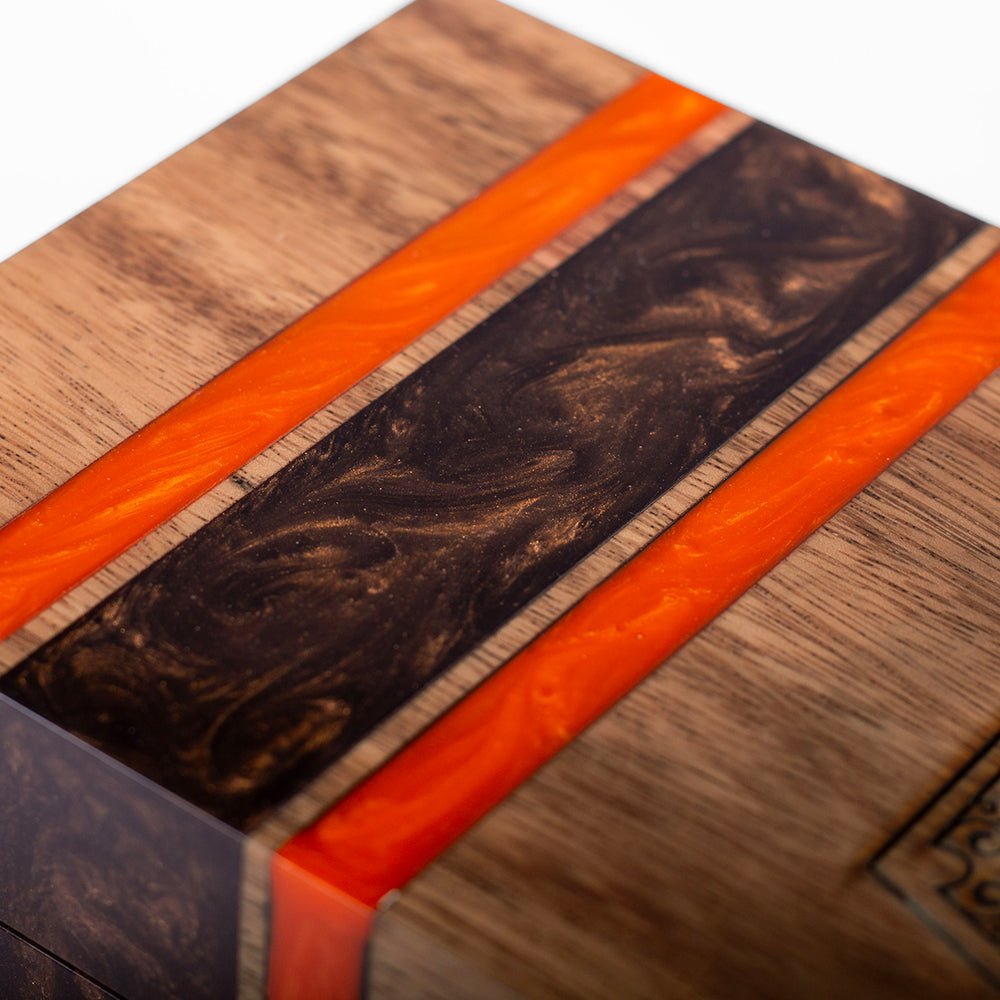 Elakai cedar-lined acacia hardwood cigar box with handcrafted resin accent and hinged lid for decorative cigar storage.

#color_cleveland