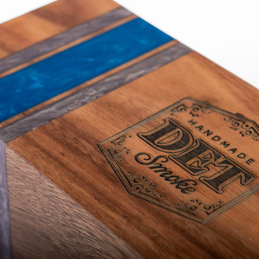 Elakai cedar-lined acacia hardwood cigar box with handcrafted resin accent and hinged lid for decorative cigar storage.

#color_detroit