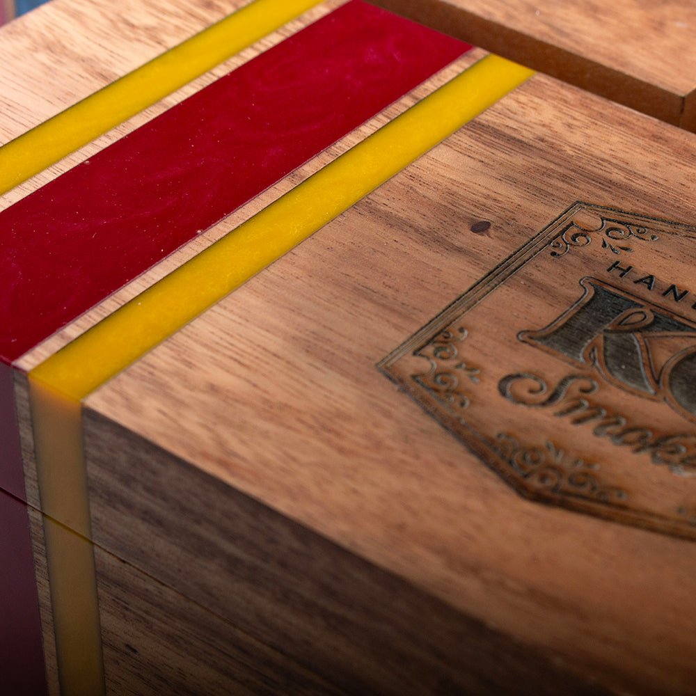 Elakai cedar-lined acacia hardwood cigar box with handcrafted resin accent and hinged lid for decorative cigar storage.

#color_kansas city