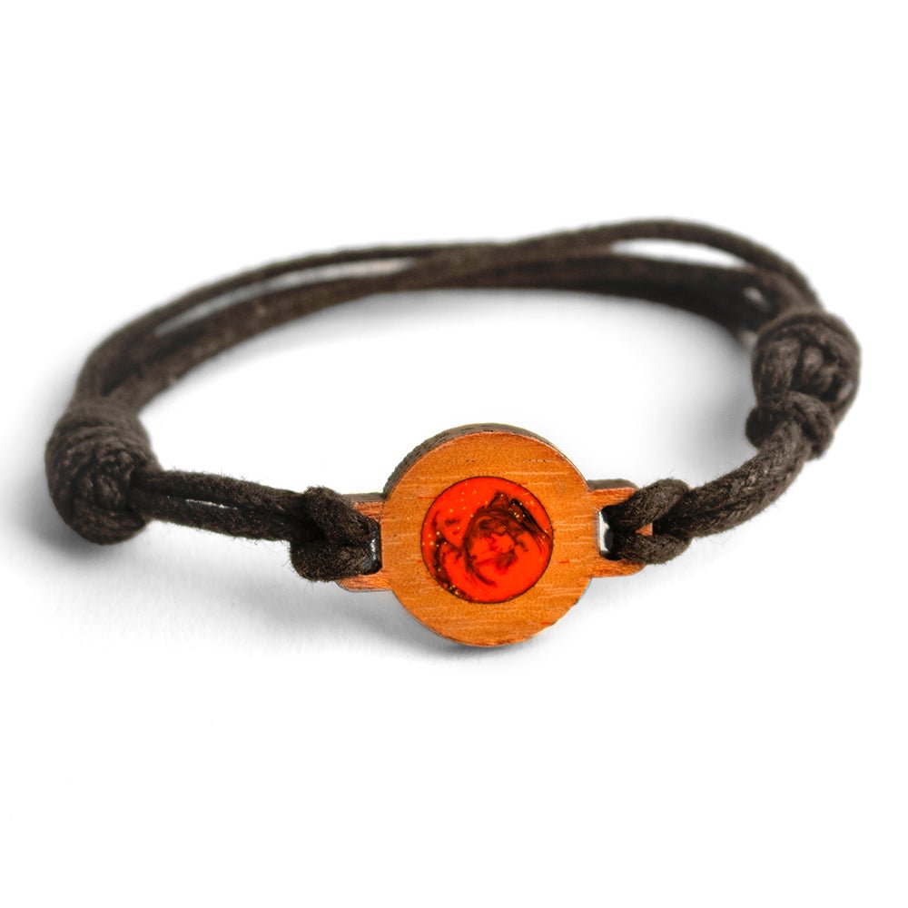 #color_orange-swirl A brown wristband bracelet with a wood element featuring a red resin swirl, and an adjustable waxed cord.