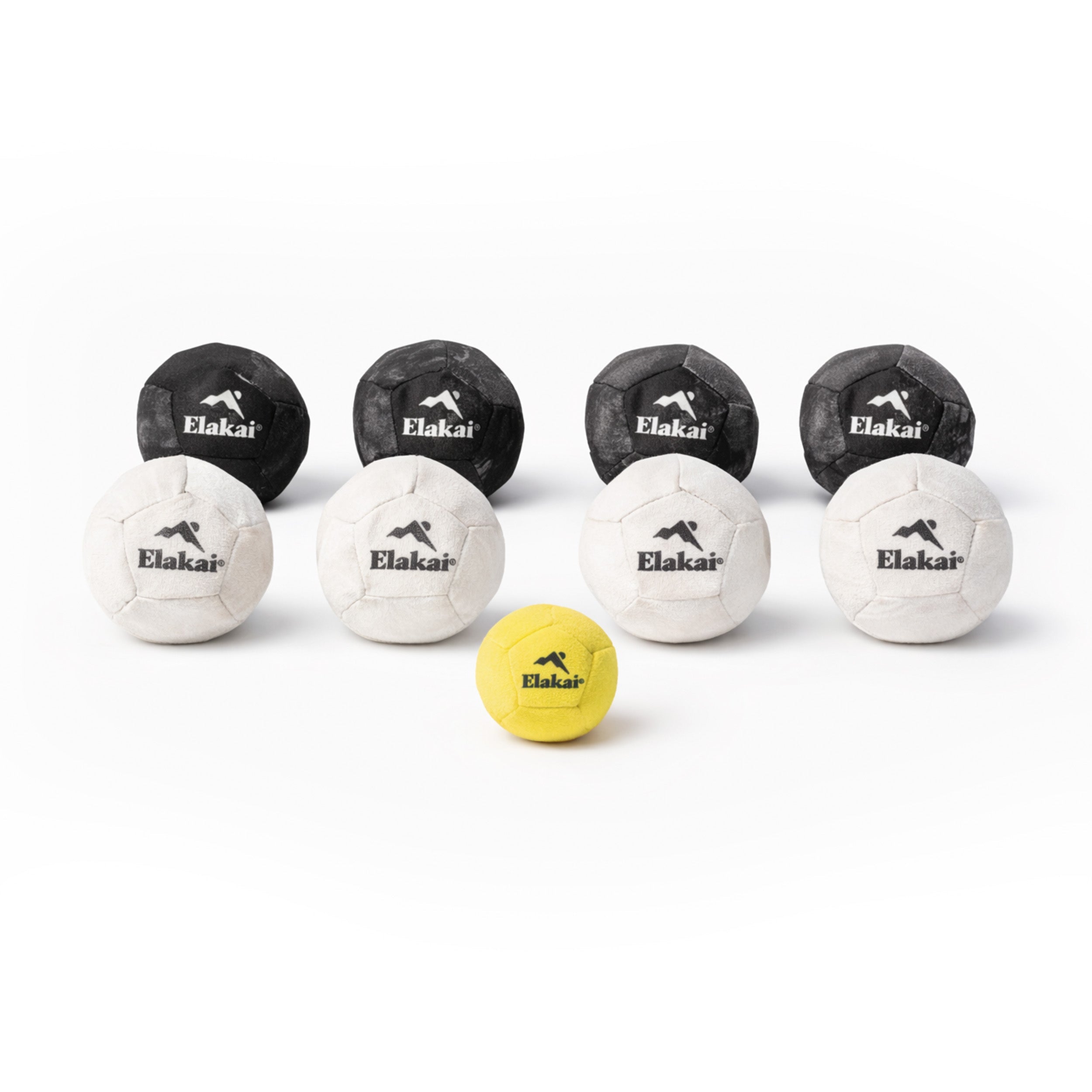 Elakai Soft Bocce balls in black, white, and yellow shown in a studio arrangement