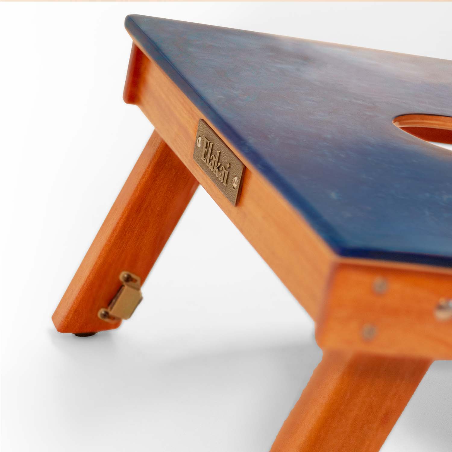 Elakai Studio Series cornhole board corner with brass logo plate and solid mahogany leg
