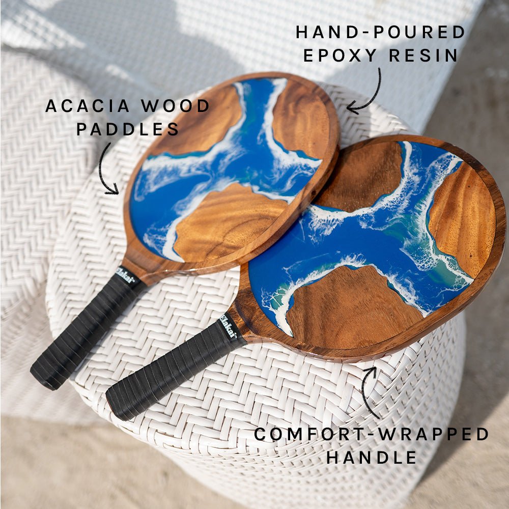 Handcrafted Elakai acacia wood paddles with coastal-inspired blue epoxy resin design