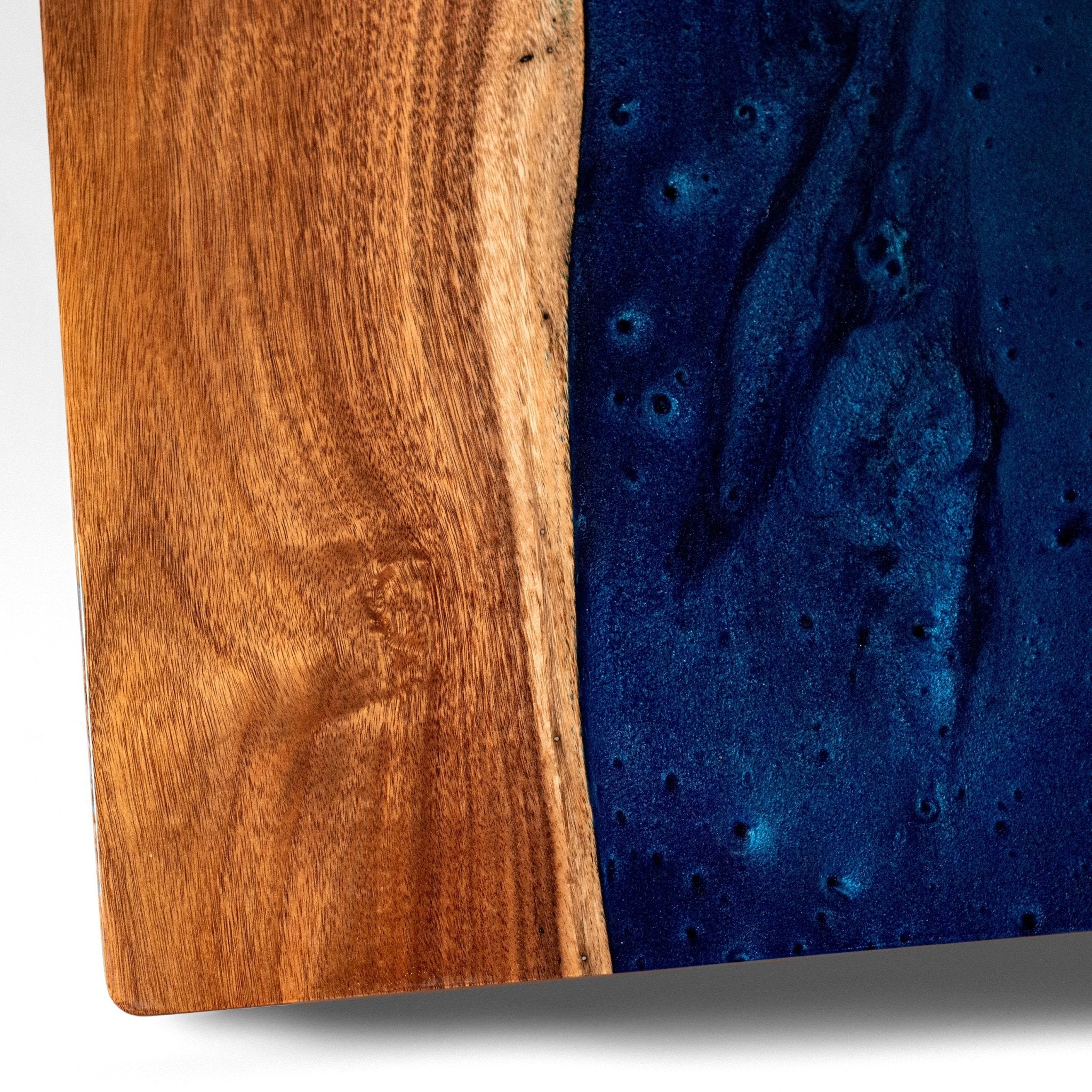 Wooden cornhole board with a blue resin inlay on a white background #color_blue pearl