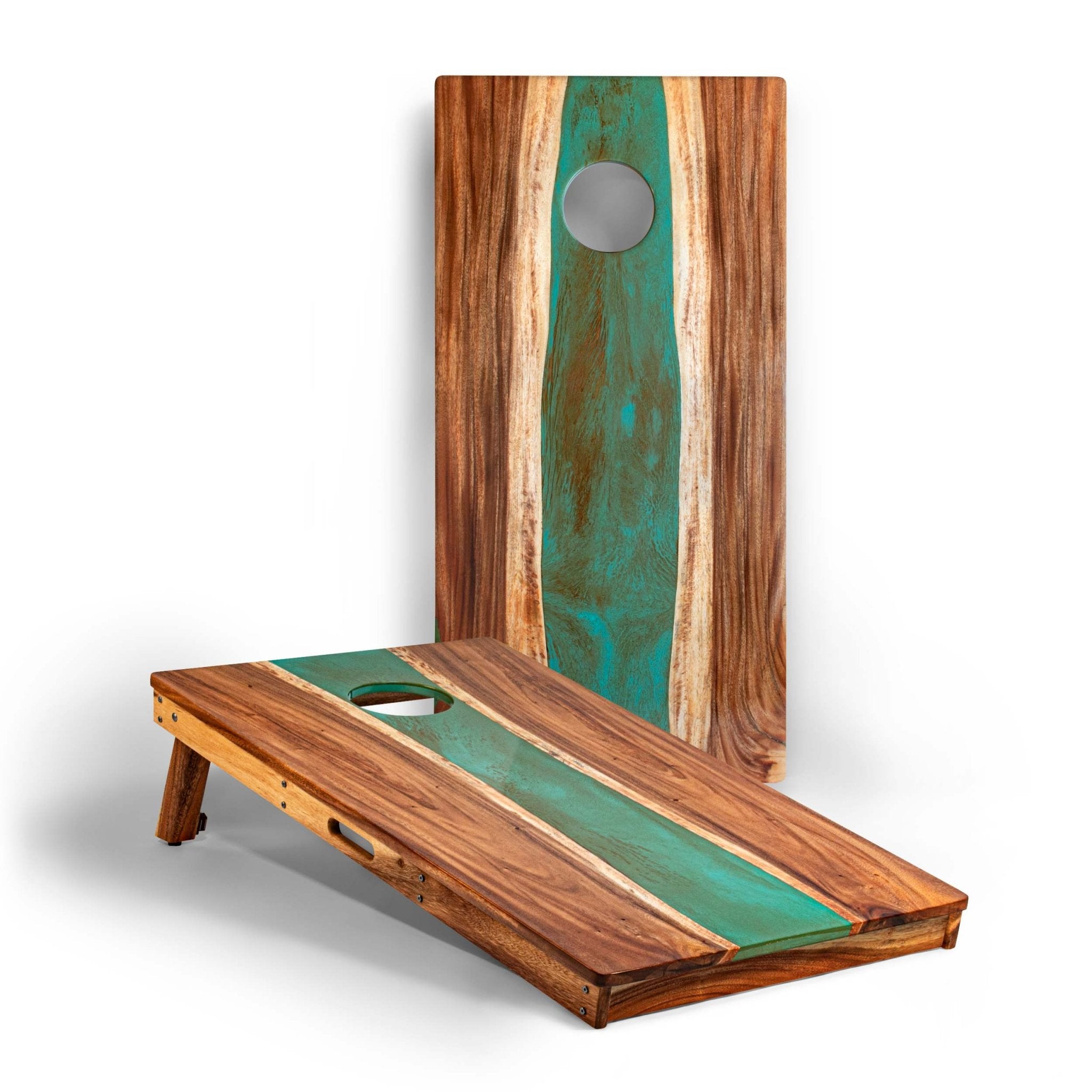 A pair of cornhole boards made from natural wood with a prominent green resin inlay, shown on a clean white background. One board is standing upright in the back, and the other is angled in the foreground to show the playing surface and scoring hole. #color_teal and orange